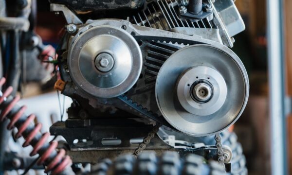 Detailed view of a mechanical assembly showing engine belt and gears. - Photo by Jessica Lewis ???? thepaintedsquare on Pexels